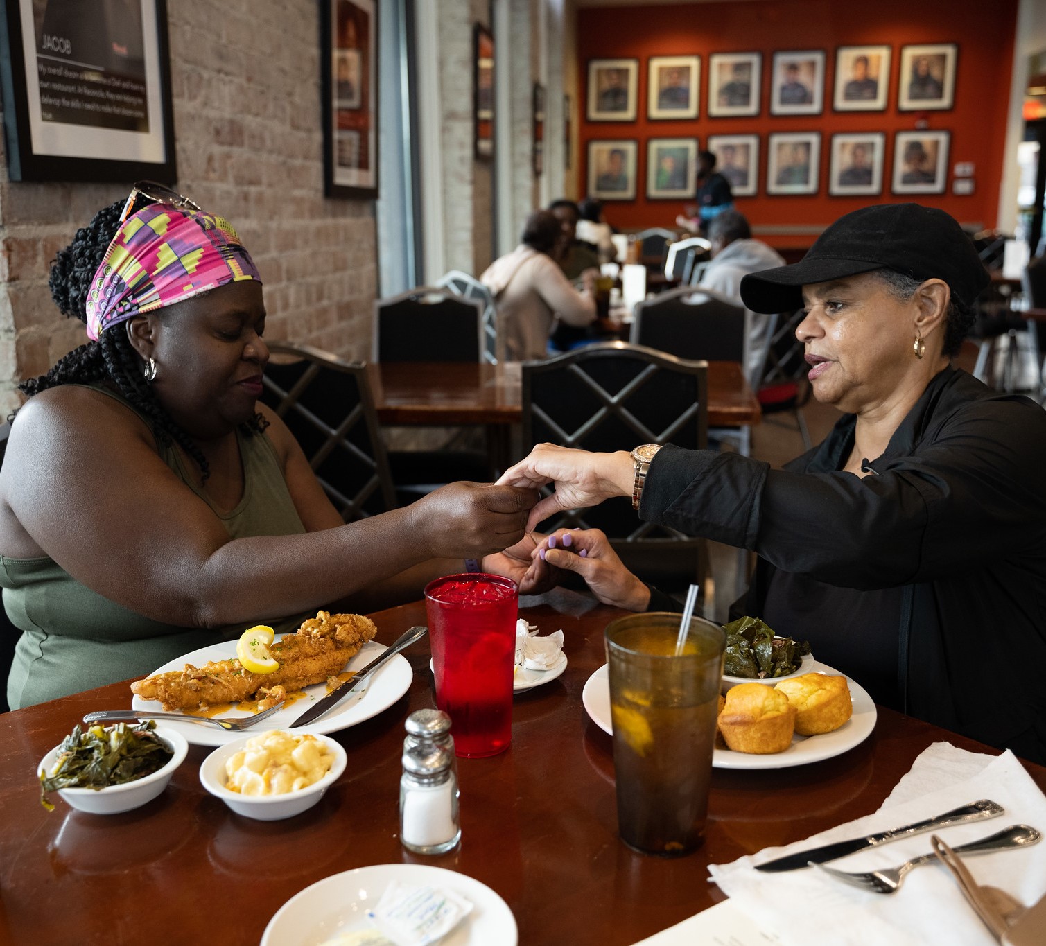 Photo of two patrons at Café Reconcile in New Orleans, Louisiana; USDA photo by Christopher Paul